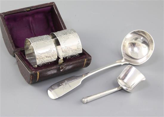 A George III silver caddy spoon, by Wardell & Kempson, ladle and cased napkin rings.